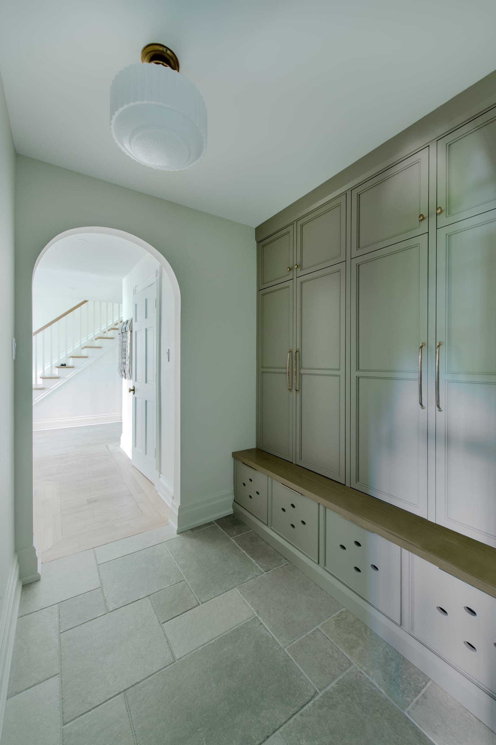 Carrison mudroom with full-height cabinetry and integrated bench storage