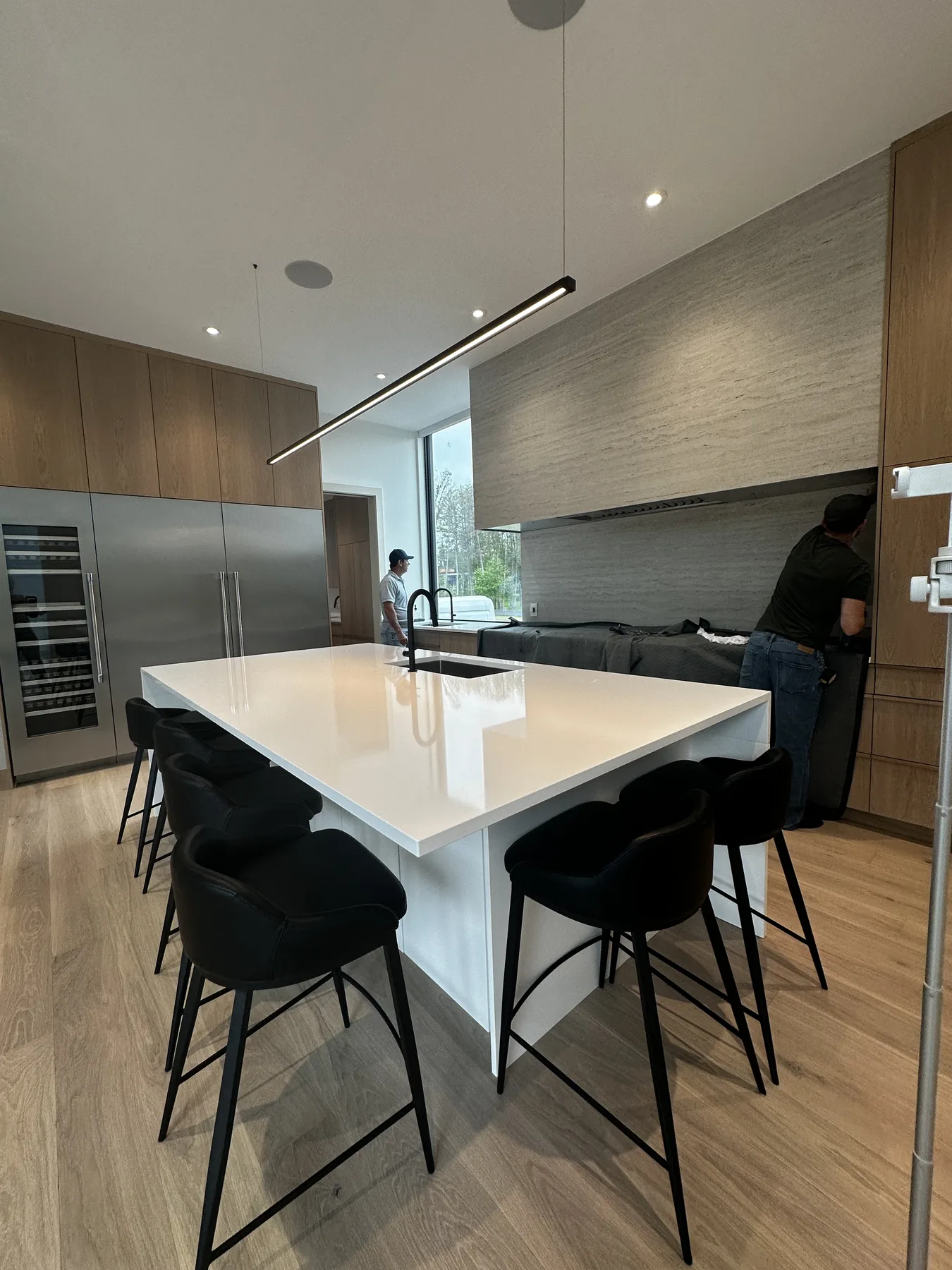O’Connor kitchen with white oak cabinetry and a broad white island